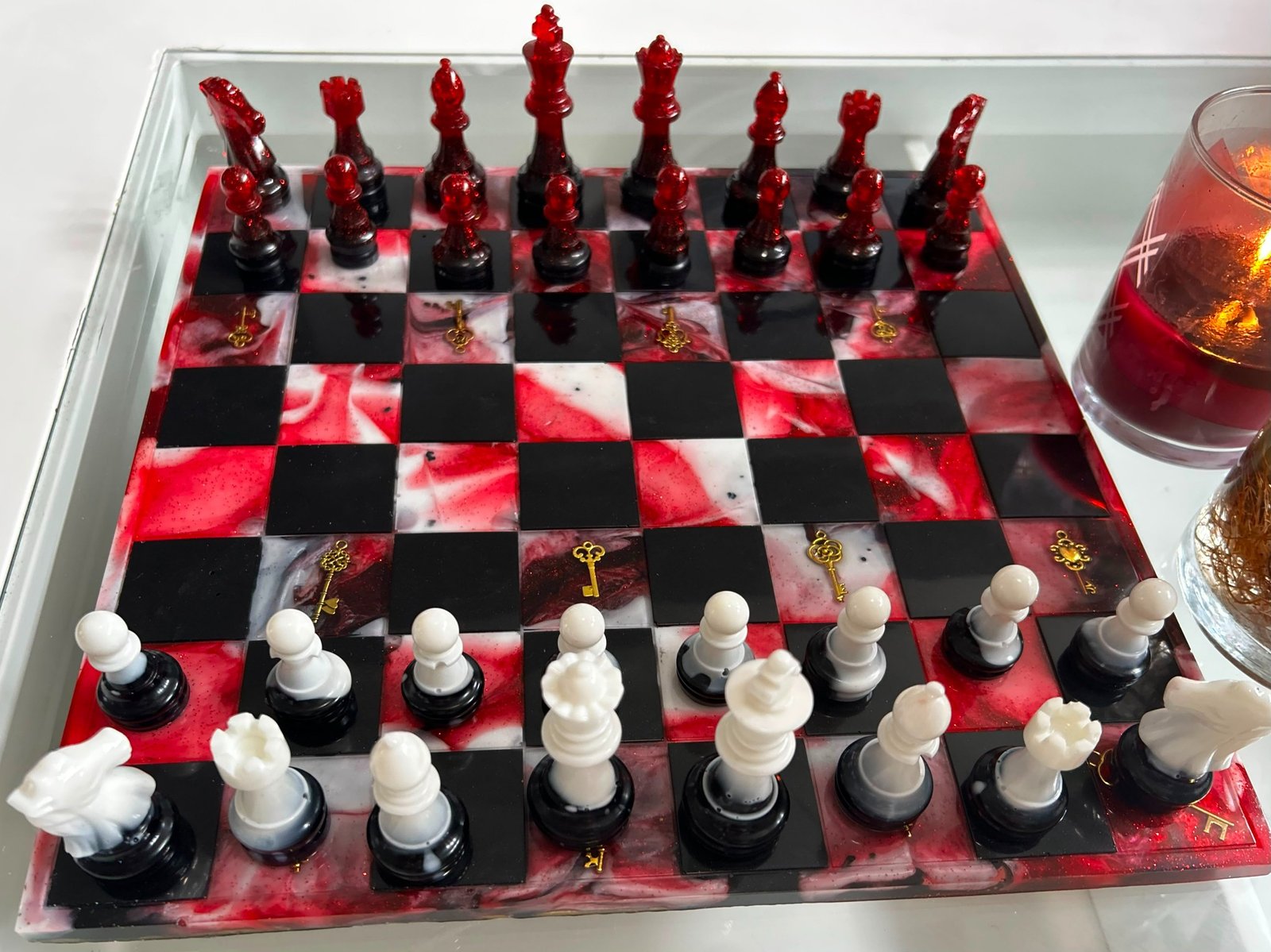 Custom red, black, and white handmade resin chess set